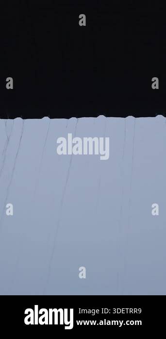 Vertical video. Heavy Rain Falling from Roof Edge in Thin Vertical ...