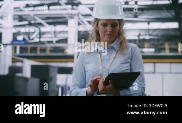 Woman in Safety Helmet Conducts Audit, Swiping Screen of Handheld ...