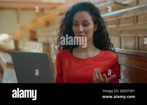 Hispanic Latina student girl in university classroom talking laptop ...