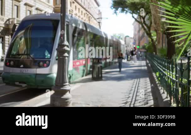 Rome street tram scene in sunlight with soft blurred bokeh and ...