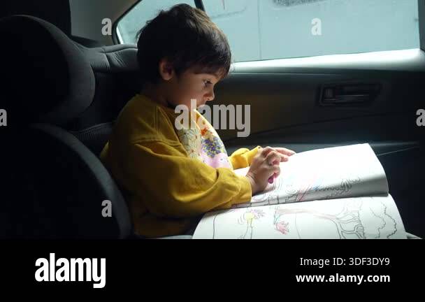 Young preschooler engaging in quiet learning activity, deeply ...