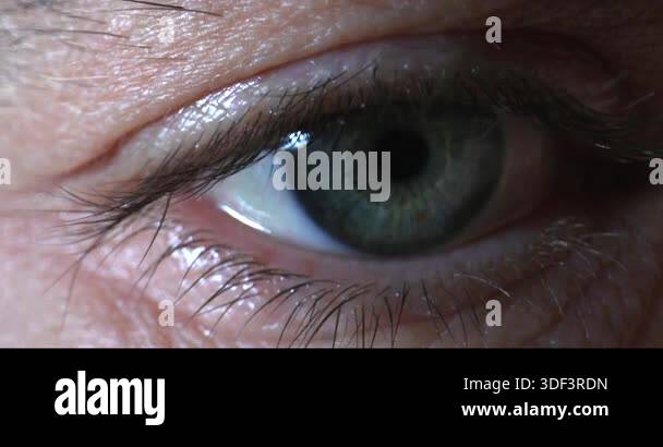 This clip showcases a close-up view of an eye with noticeable colors ...