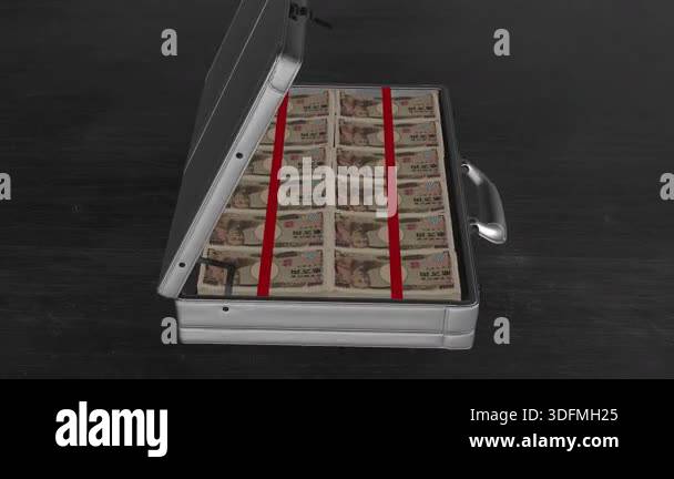Briefcase packed with Japanese 10,000 yen notes viewed from a dynamic ...
