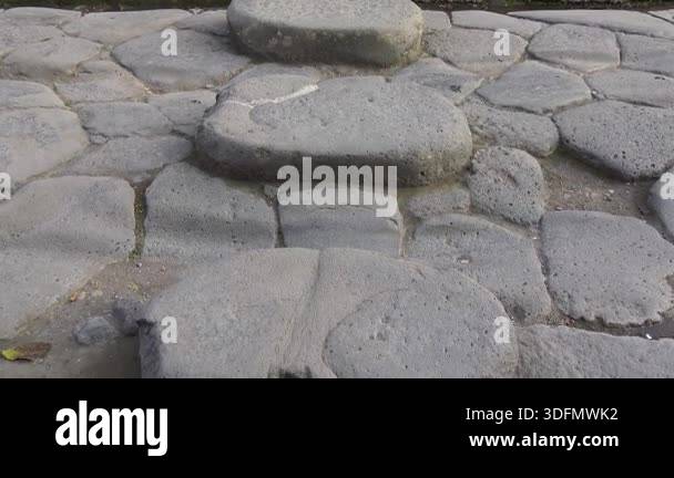 Close-up view of stone stepping blocks on an ancient Roman street in ...