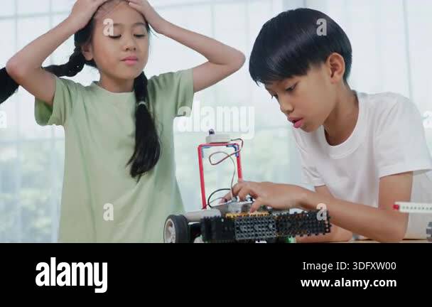 Asian children engineer working on robotics project in a STEM education ...