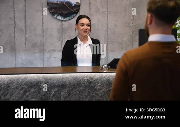 Hotel receptionist smiling processing Stock Videos & Footage - HD and ...