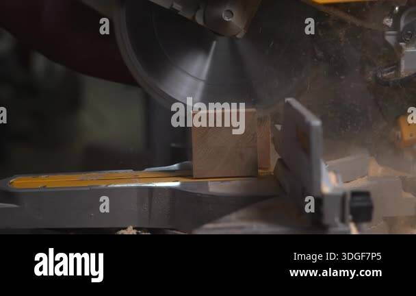 Operator Hands Cutting Timber Block With Miter Saw, Sparks Of Sawdust ...
