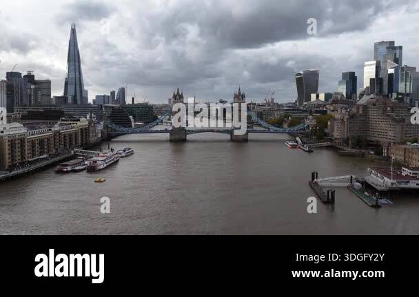 Aerial drone view of Tower Bridge spanning the River Thames, showcasing ...