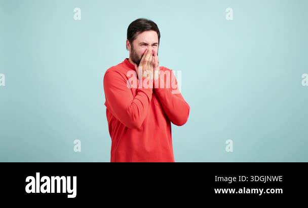Man with a beard pinching his nose because of a bad smell, showing ...