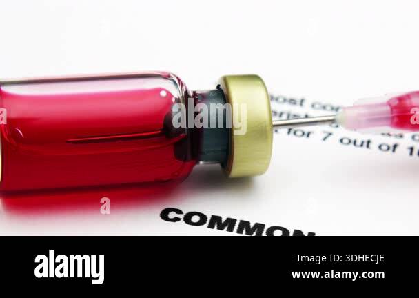 Medical Injection Scene With Syringe And Vial Over Document About ...