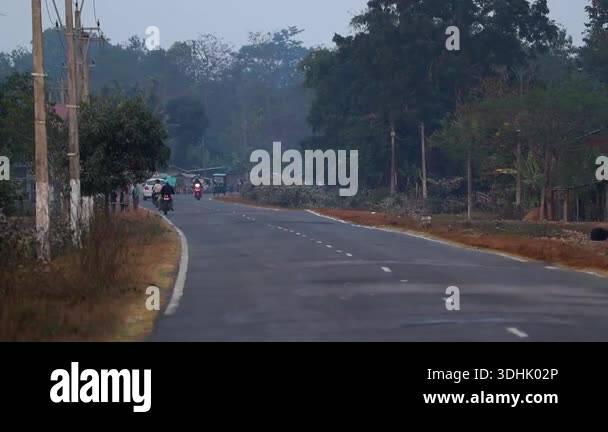 Dibrugarh, Assam, India 10 January 2026: Motorcyclists ride along a ...