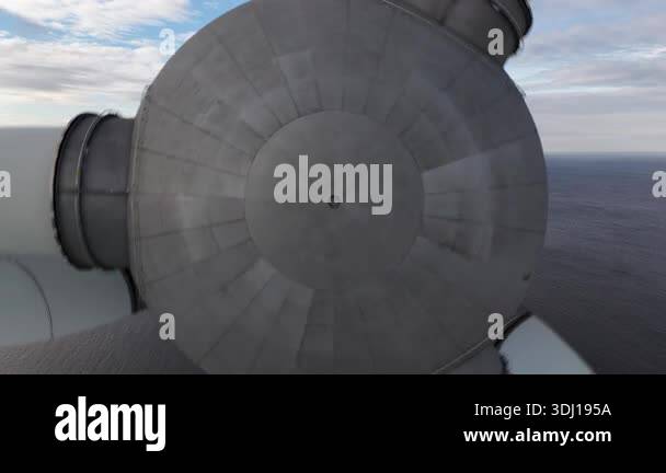 Offshore Rotor Sign Drone view pulling away from a massive wind turbine rotor with its ...