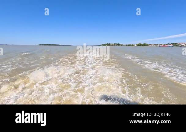 Waves trailing behind a moving boat Stock Video Footage - Alamy
