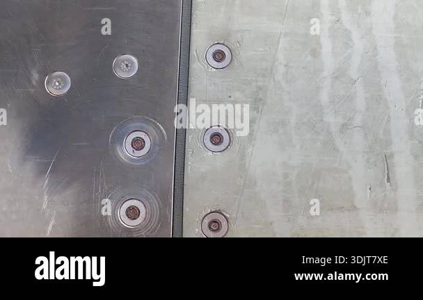 Rivet Rash Detailed view shows two aircraft fuselage panels meeting along a narrow ...