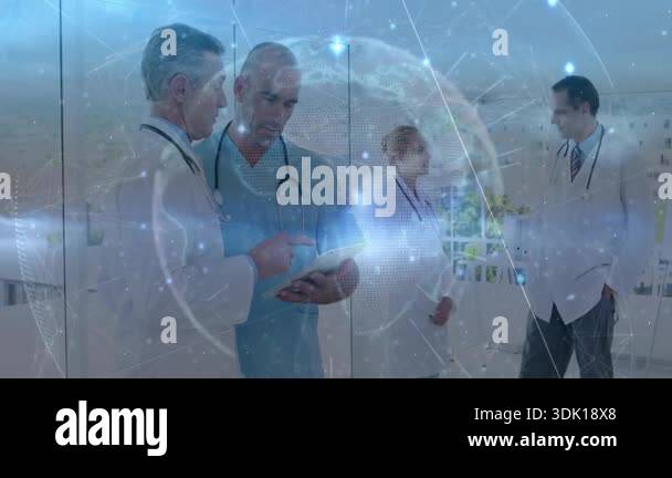 Senior doctor and clinician pointing tablet while nurse tapping medical ...