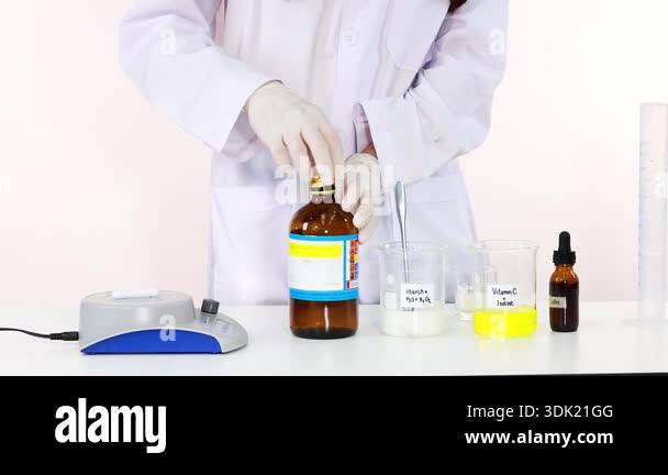 Scientist performing iodine clock chemical reaction experiment in ...
