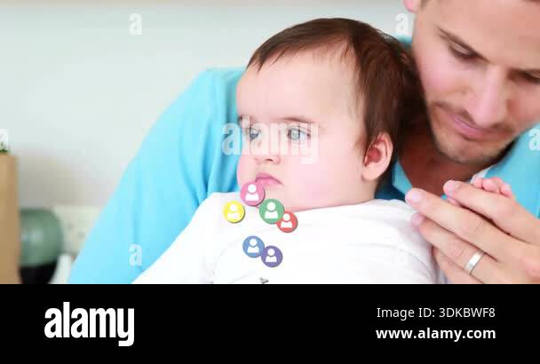 Father holding baby kissing hand triggers animated social profile icons ...