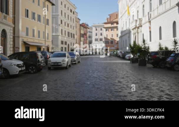 Blurred rome street with soft bokeh on cobblestone pavement and ...