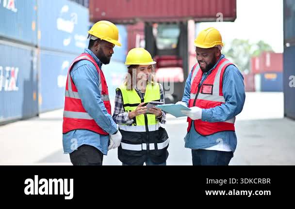 Group of men and women of professional container operators standing in ...