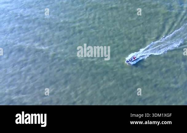 Speedboat moving fast on the blue sea seen from drone, Aerial view of ...