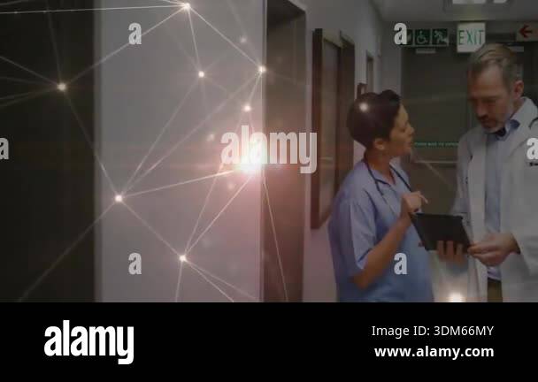 Launching Doctor Nurse tapping tablet screen in hospital, launching animated chart ...