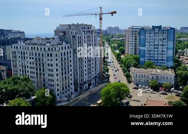 Vibrant cityscape on sunny hot summer day. Many multi-story high-rise ...