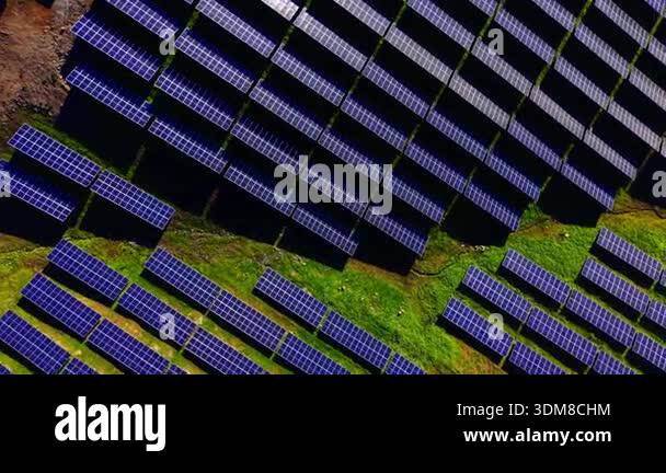 Detailed top-down aerial view of photovoltaic panels installed on a ...