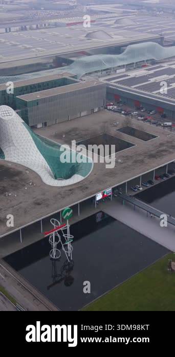 Panoramic aerial footage of the modern architecture of the fiera milano ...