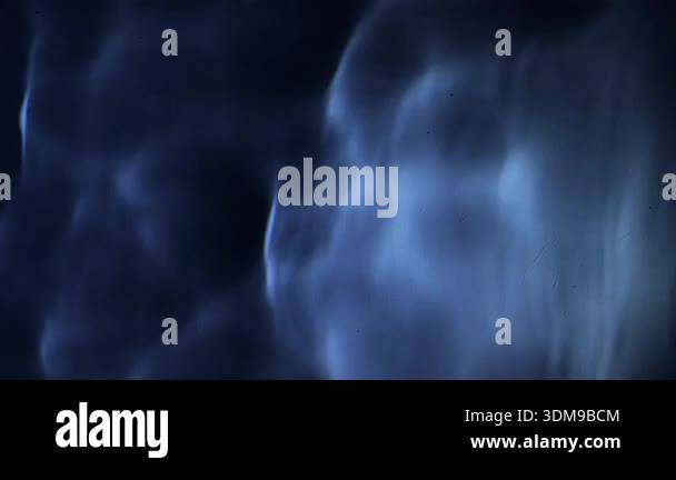 Liquid Dim Rippling water surface of a pool, background pattern, dim lamp light ...