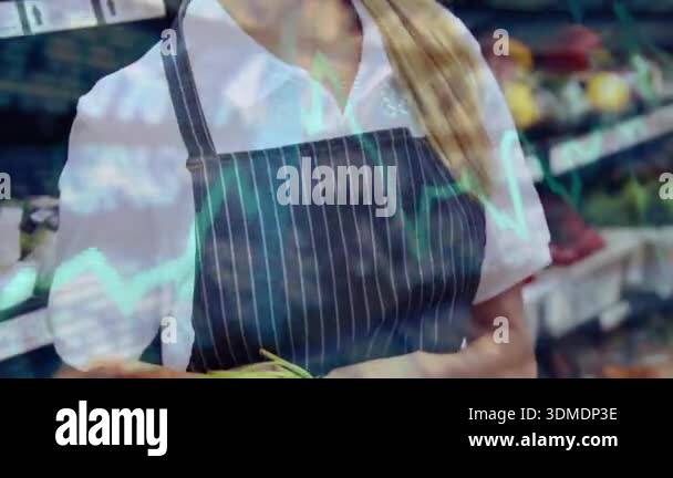 Grocery employee receiving scallions from customer and sorting while ...