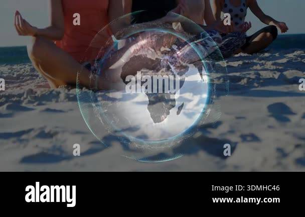 Four women meditating on beach with globe animation emerging and ...