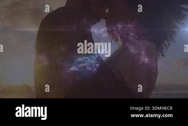 Man and woman leaning foreheads at sunset beach sparking nebula overlay ...