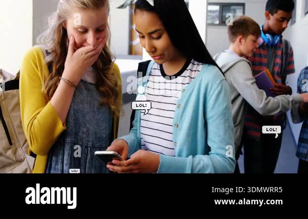 Female students receiving smartphone ping and reacting to animated LOL ...