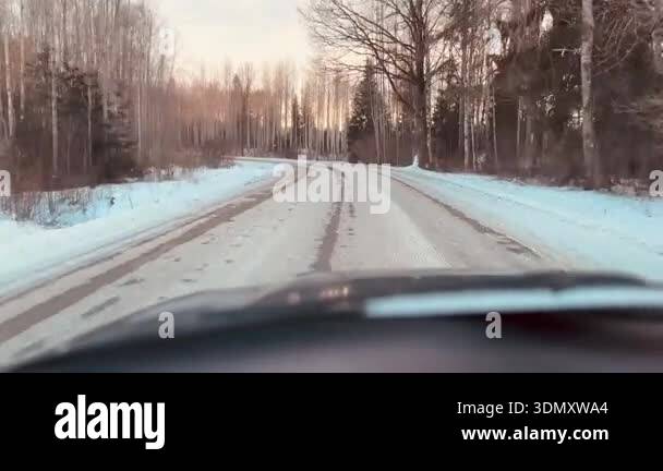 View through the front windshield of a car driving along a dangerous ...