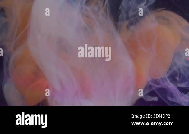 Steam Ink Color Ink steam. Swirling mist. Defocused orange blue purple color glitter ...