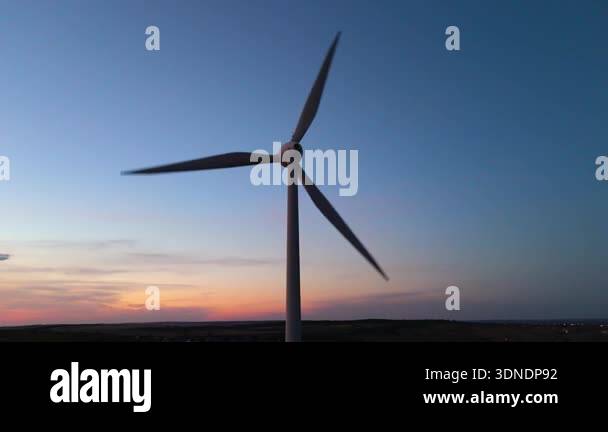 Wind turbine and solar panels in sustainable energy landscape. Wide ...