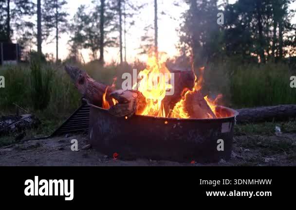 Fire burning in metal container outdoors Stock Video Footage - Alamy