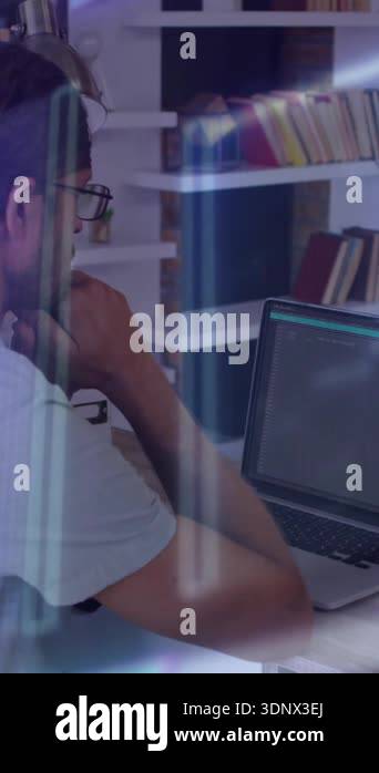 Man working on laptop with digital data processing animation overlay ...