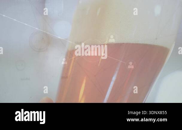 Hand entering frame lifting glass while icons multiplying and network ...
