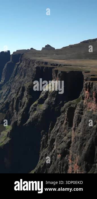 aerial escarpment ridge with long row of cliffs receding into horizon ...