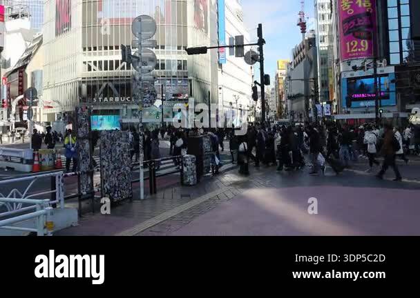Tokyo, Japan- 16 Dec 2025: People crossing the iconic Shibuya Scramble ...