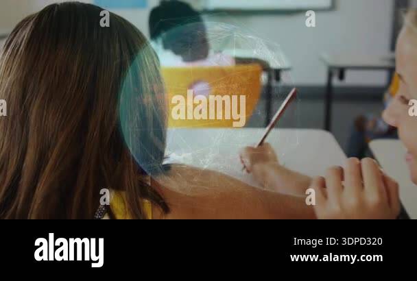 Brunette student writing after blonde student whispering showing ...