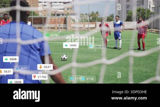 Free-kick taker positioning ball and shooting toward goal as reaction ...