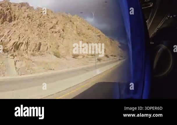 Passenger point of view bus ride from Aqaba to Amman desert mountains ...