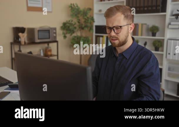 Curated visual reference: Visual Reference: Young Man With Hands On Head At Office Desk Wearing