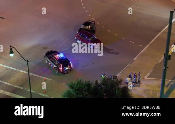 First responders responding to car accident site on American street ...