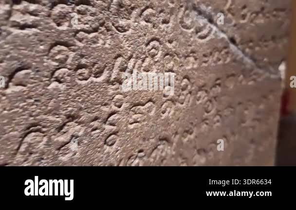 Close up video on An ancient stone inscription in ancient language ...