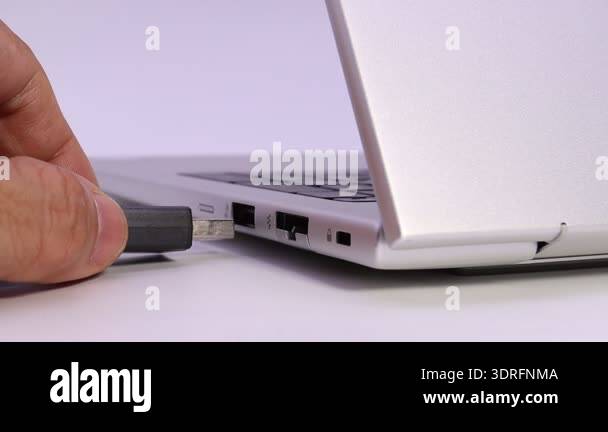 Insertar Usb hand inserting usb flash drive into laptop port for data storage and ...