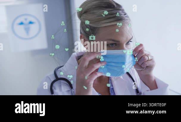 Doctor grabbing blue surgical mask and fitting in clinic with icons ...