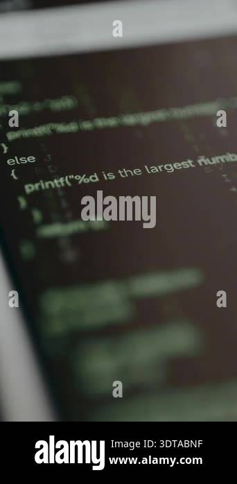 Computer source code displayed on a laptop screen, matrix style Stock ...